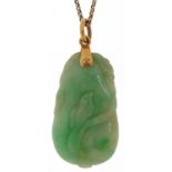 Chinese carved green jade pendant in the form of fruit with unmarked gold mount on a 9ct gold