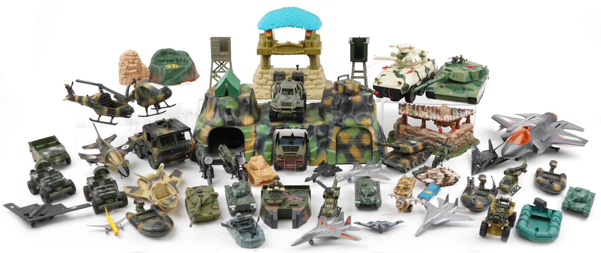 Collection of vintage and later army related toys including fighter jets and tanks