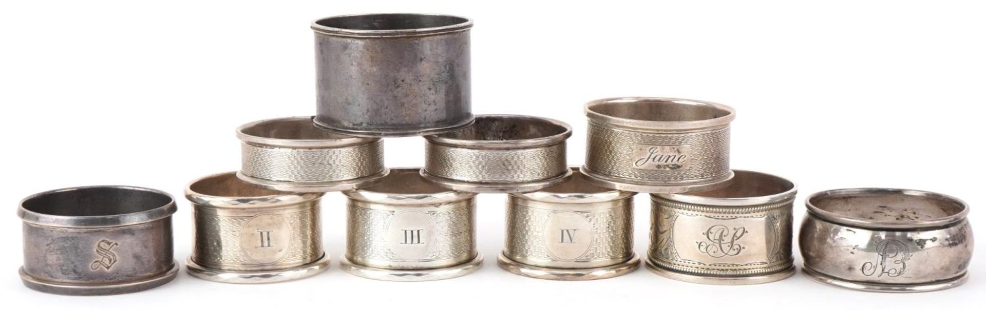 Ten Victorian and later silver napkin rings, some with engine turned decoration, the largest 5cm