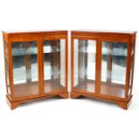 Pair of inlaid yew wood display cabinets, each fitted with two adjustable glass shelves, each