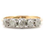 18ct gold and platinum graduated diamond five stone ring, the largest diamond approximately 4.80mm x