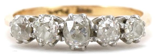 18ct gold and platinum graduated diamond five stone ring, the largest diamond approximately 4.80mm x