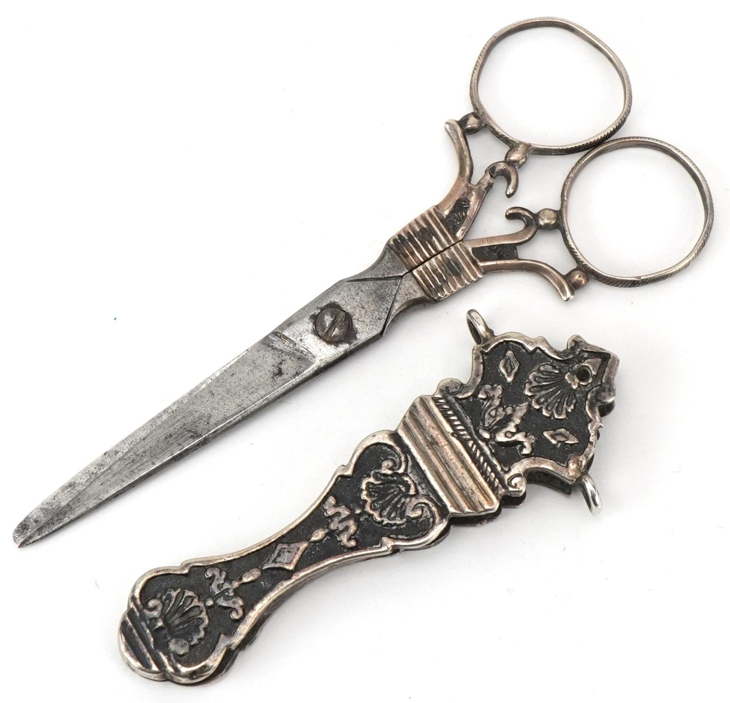 Pair of continental unmarked silver and steel chatelaine scissors with sheath, 11.5cm in length,