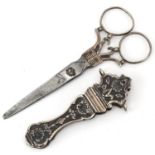 Pair of continental unmarked silver and steel chatelaine scissors with sheath, 11.5cm in length,