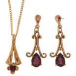 9ct gold ruby pendant on a 9ct gold necklace and a pair of 9ct gold garnet teardrop earrings, the