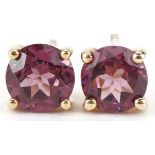 Pair of 9ct gold pink tourmaline solitaire stud earrings, each 5.8mm in diameter, total 1.6g
