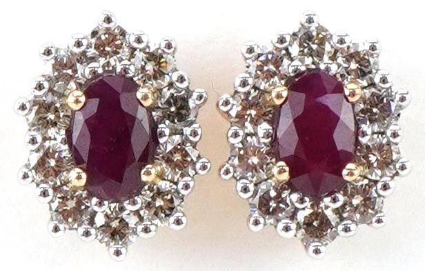 Pair of 9ct gold ruby and diamond cluster stud earrings, total diamond weight approximately 0.51