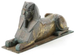 Bronze model of a sphinx, 26cm in length