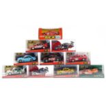 Ten Matchbox SCX 1:32 scale model slot cars with cases including Skoda Octavia WRC, Opel Astra V8