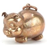 9ct gold charm in the form of a comical pig, 1.9cm in length, 1.3g