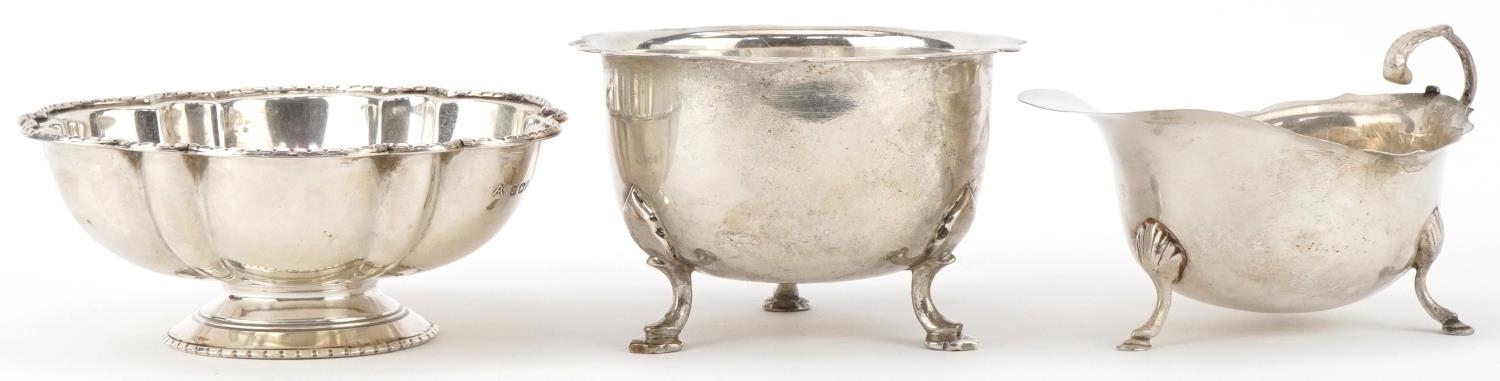 George V and later silver comprising bowl raised on three hoof feet, sauce boat raised on three hoof