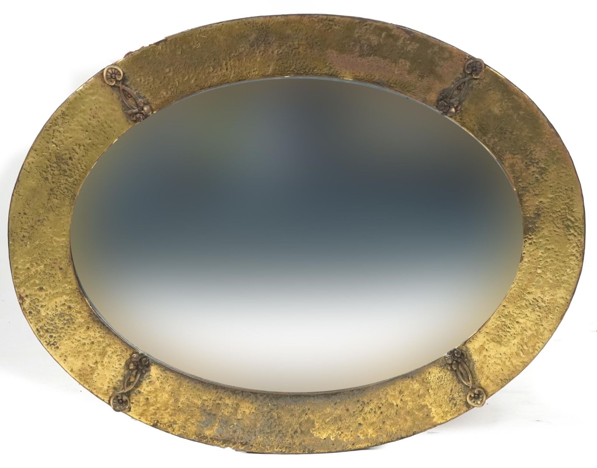 Arts & Craft brass oval wall mirror with bevelled glass, 75cm x 58cm