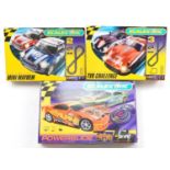 Three Scalextric 1:32 scale slot car racing sets comprising Mini Mayhem, TVR Challenge and Power