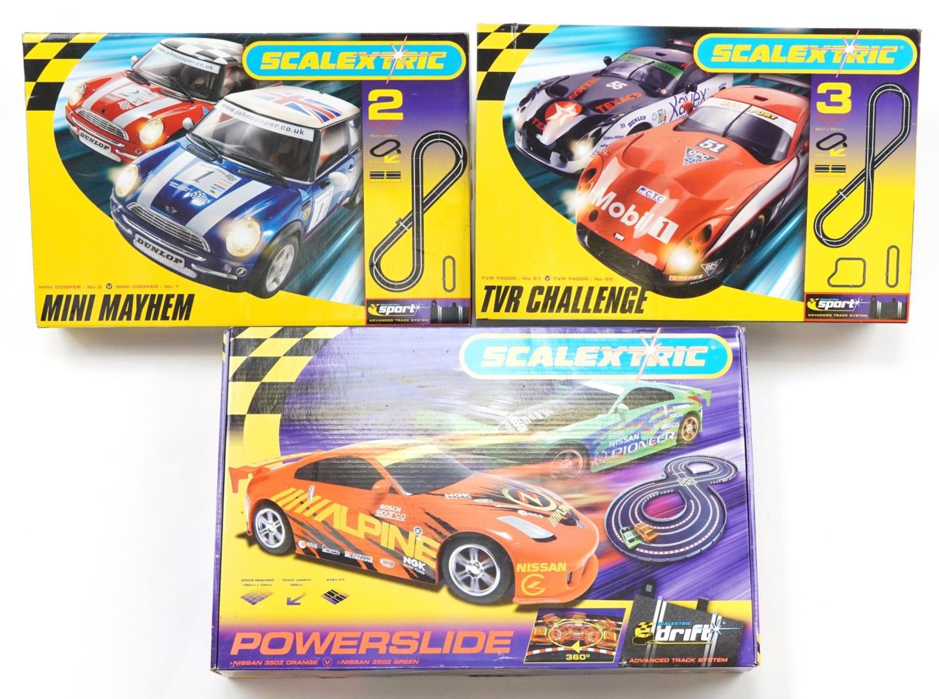 Three Scalextric 1:32 scale slot car racing sets comprising Mini Mayhem, TVR Challenge and Power
