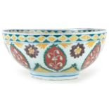 Turkish Ottoman Kutahya bowl hand painted with stylised flowers and foliage, 21cm in diameter