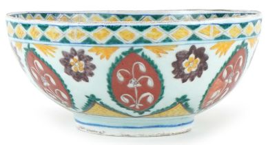 Turkish Ottoman Kutahya bowl hand painted with stylised flowers and foliage, 21cm in diameter