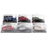 Six Carrera Evolution slot cars with cases comprising Aston Martin DB3, Chevrolet Corvette