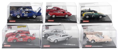 Six Carrera Evolution slot cars with cases comprising Aston Martin DB3, Chevrolet Corvette