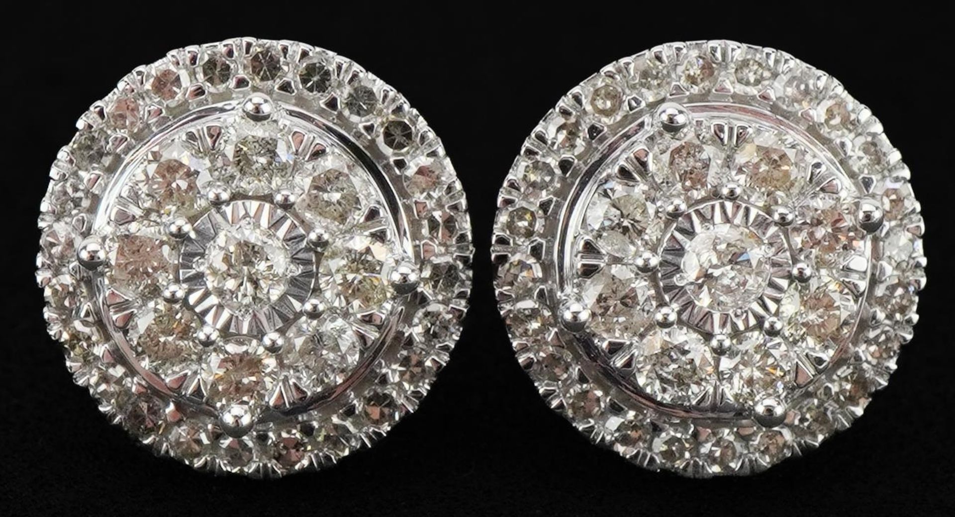 Pair of 9ct white gold diamond cluster stud earrings, total diamond weight approximately 1.0