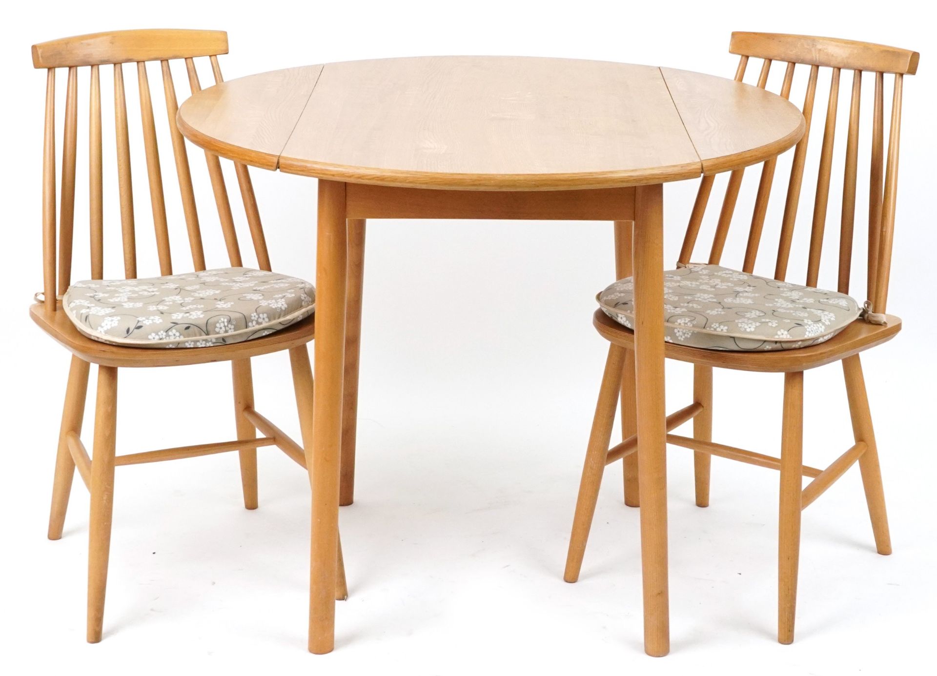 Ercol style lightwood drop end dining table with two stick back chairs, the table 74cm H x 55cm W