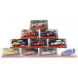 Ten Matchbox SCX 1:32 scale model slot cars with cases including Citroen C2, Mitsubishi Lancer and
