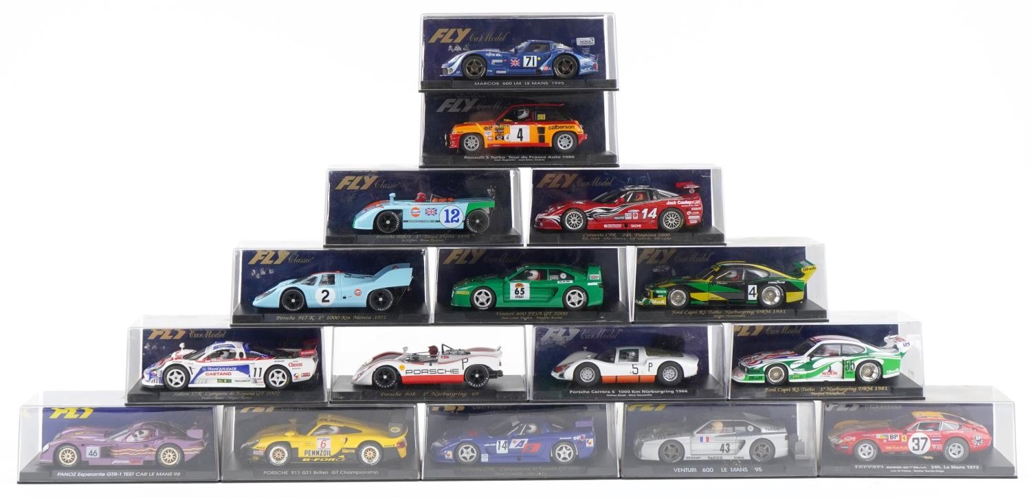 Sixteen Fly 1:32 scale model slot cars with cases including Renault 5 Turbo, Ford Capri RS Turbot