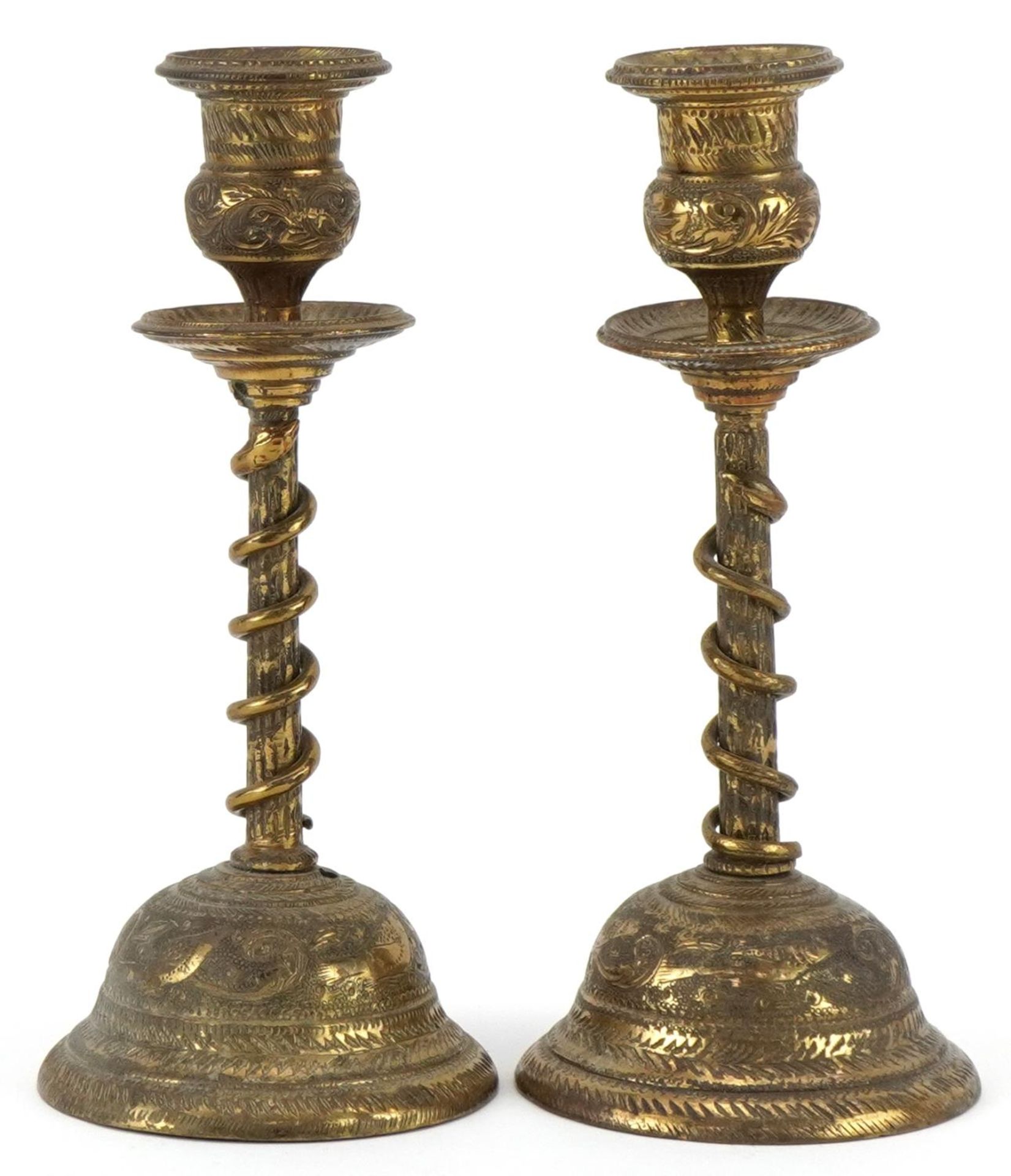 Pair of Indian brass serpent candlesticks engraved with flowers and mythical birds, each 18cm high