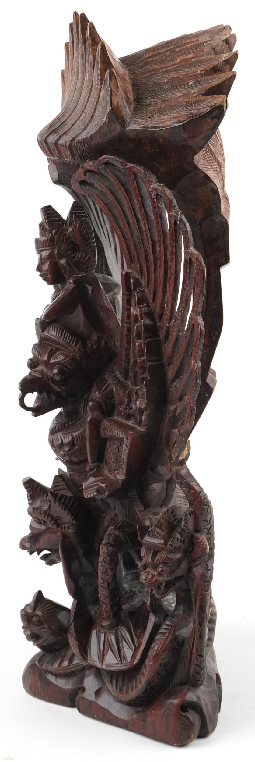 Large Burmese hardwood carving of a deity and mythical animals, 56cm high - Image 2 of 6