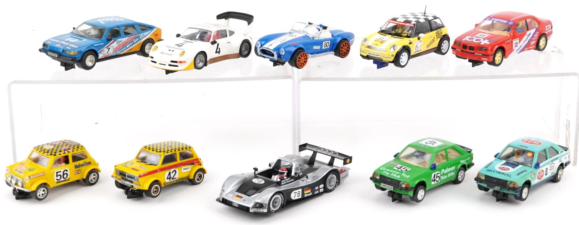Ten vintage and later slot cars including Scalextric, Carrera Evolution and Hornby
