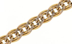 A 9ct gold two tone multi link bracelet, 19.7cm in length, 3.4g.