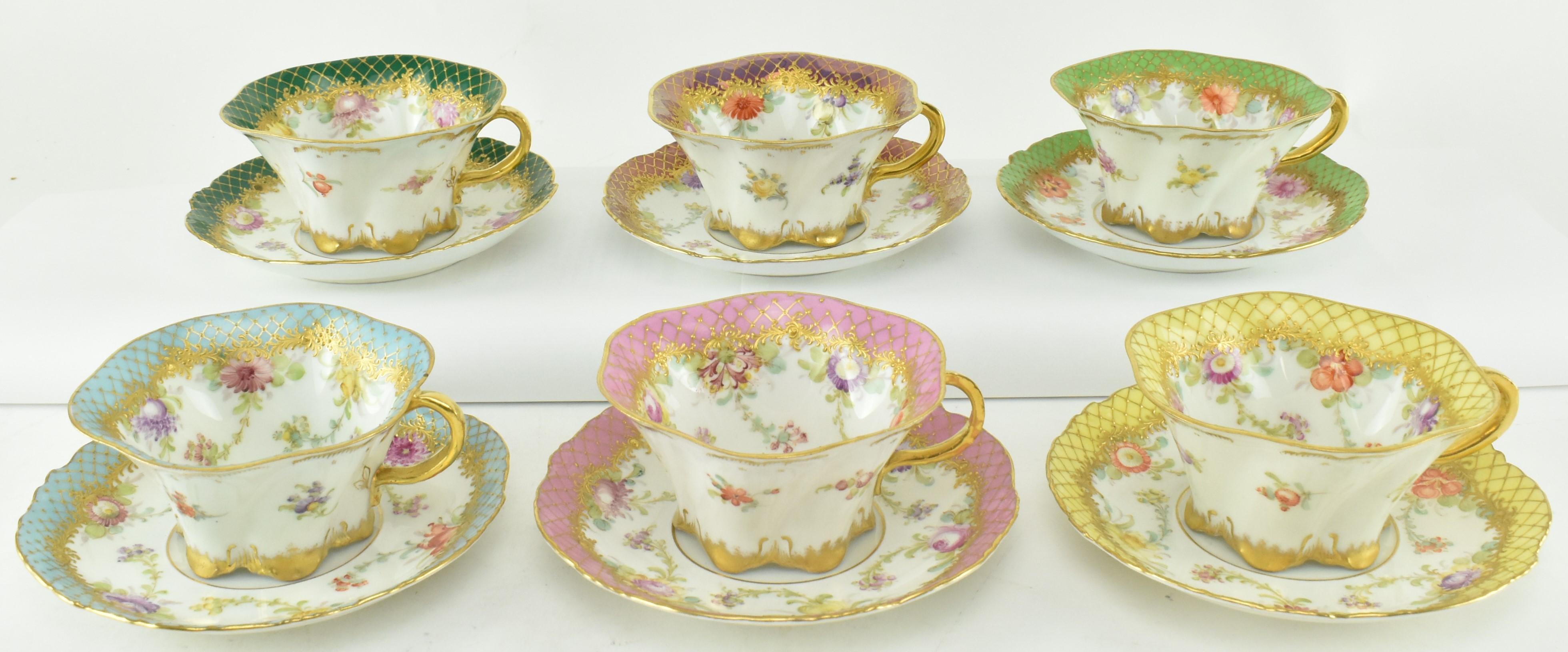 SIX DRESDEN HAND PAINTED CHINA RIBBON EDGE CUPS AND SAUCERS