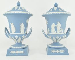 PAIR OF WEDGWOOD JASPERWARE CERAMIC LIDDED URNS ON STANDS