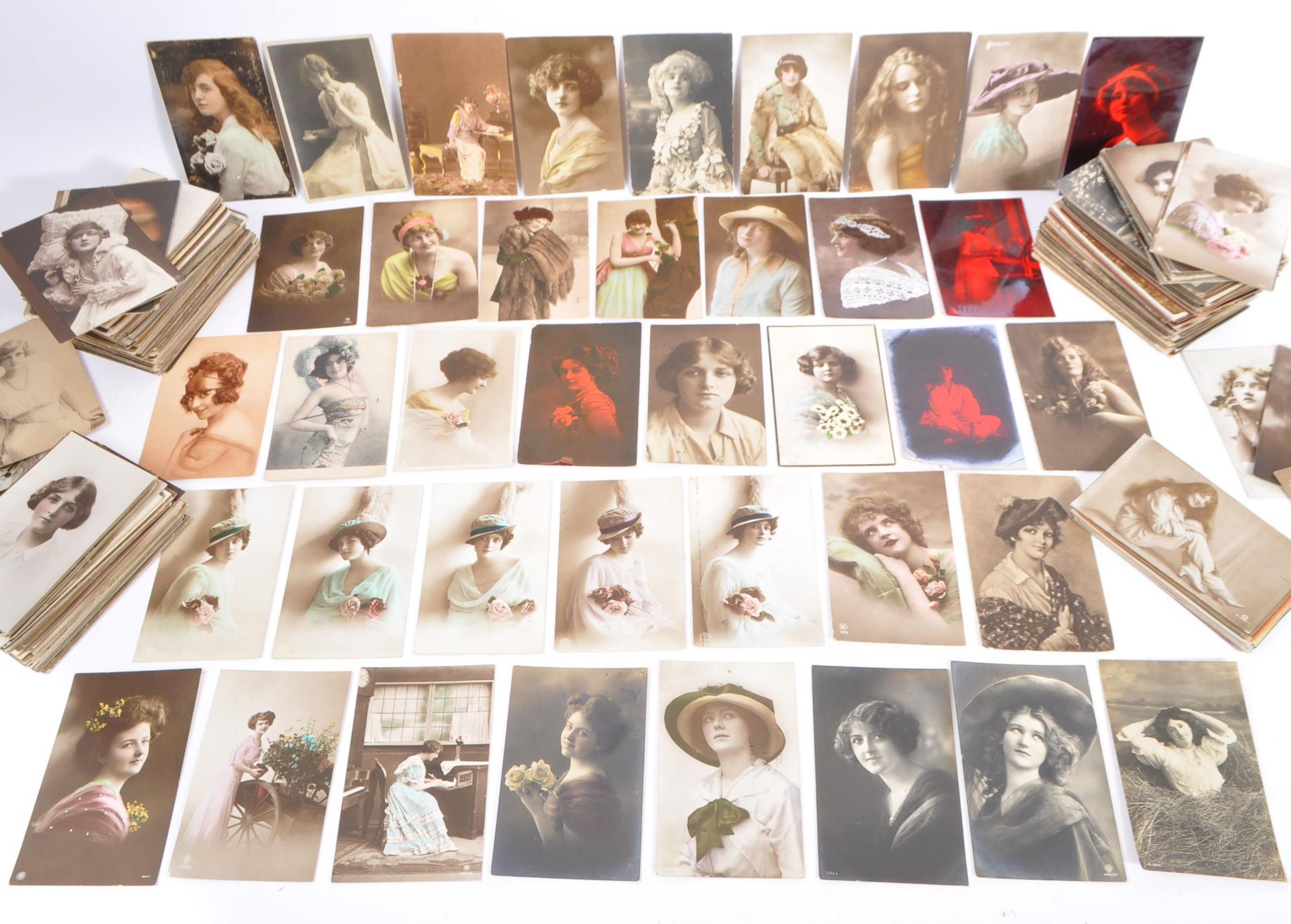 A collection of Edwardian 1920s Glamour / romance postcards. Attractive girls / beautiful young
