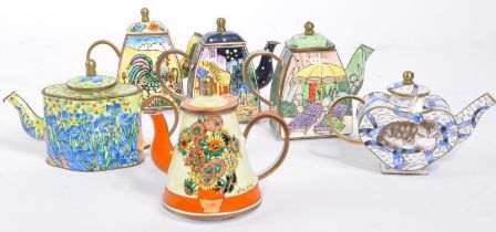 SIX MINIATURE ENAMEL & DECORATED BRASS TEAPOTS