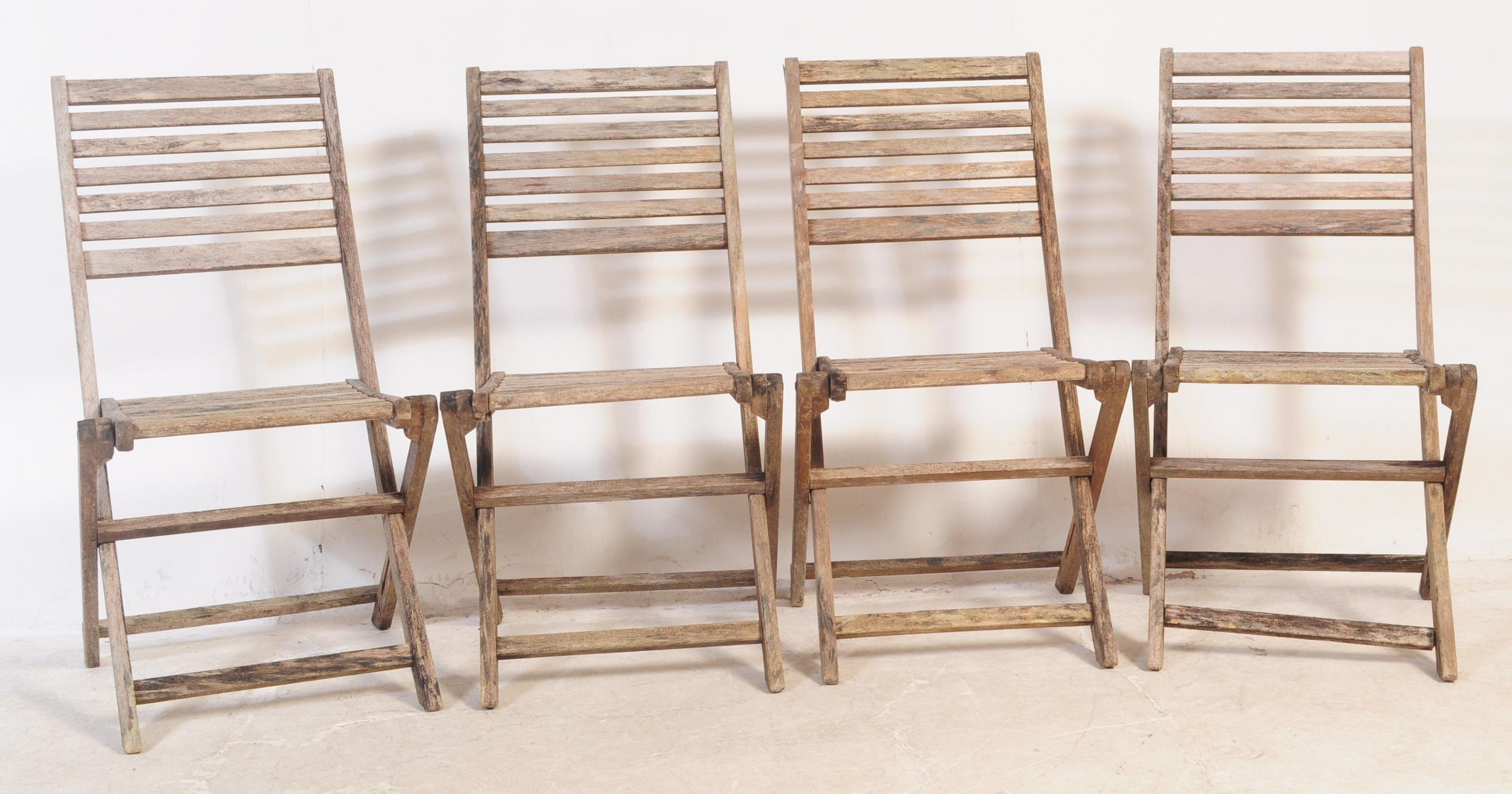 SET OF FOUR 20TH CENTURY TEAK FOLDING GARDEN CHAIRS