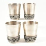 FOUR RUSSIAN WHITE METAL VODKA TOT BEAKERS