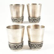 FOUR RUSSIAN WHITE METAL VODKA TOT BEAKERS