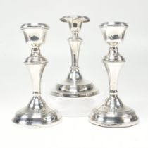 THREE 20TH CENTURY HALLMARKED SILVER CANDLESTICKS