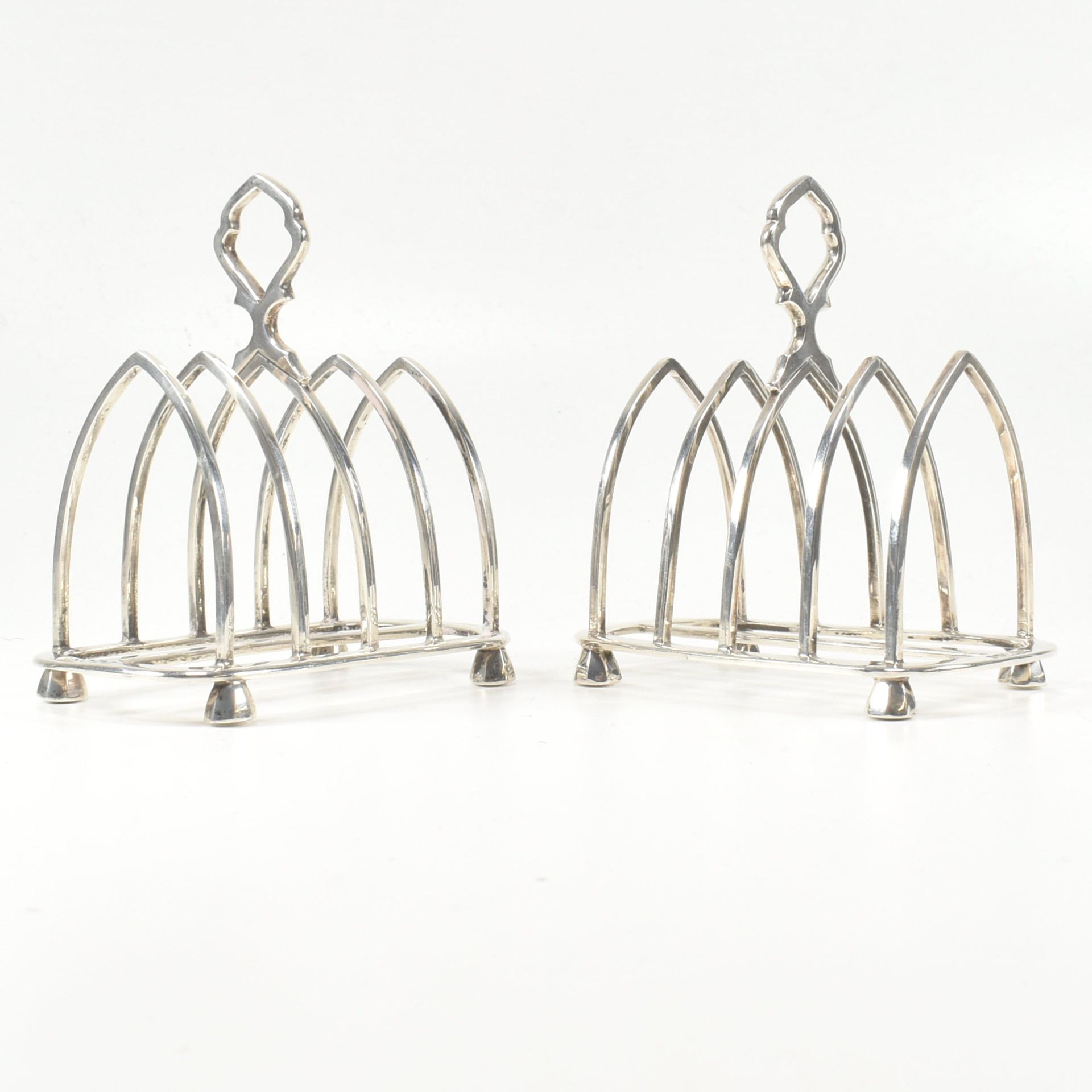 GEORGE V MATCHED PAIR OF HALLMARKED SILVER TOAST RACKS