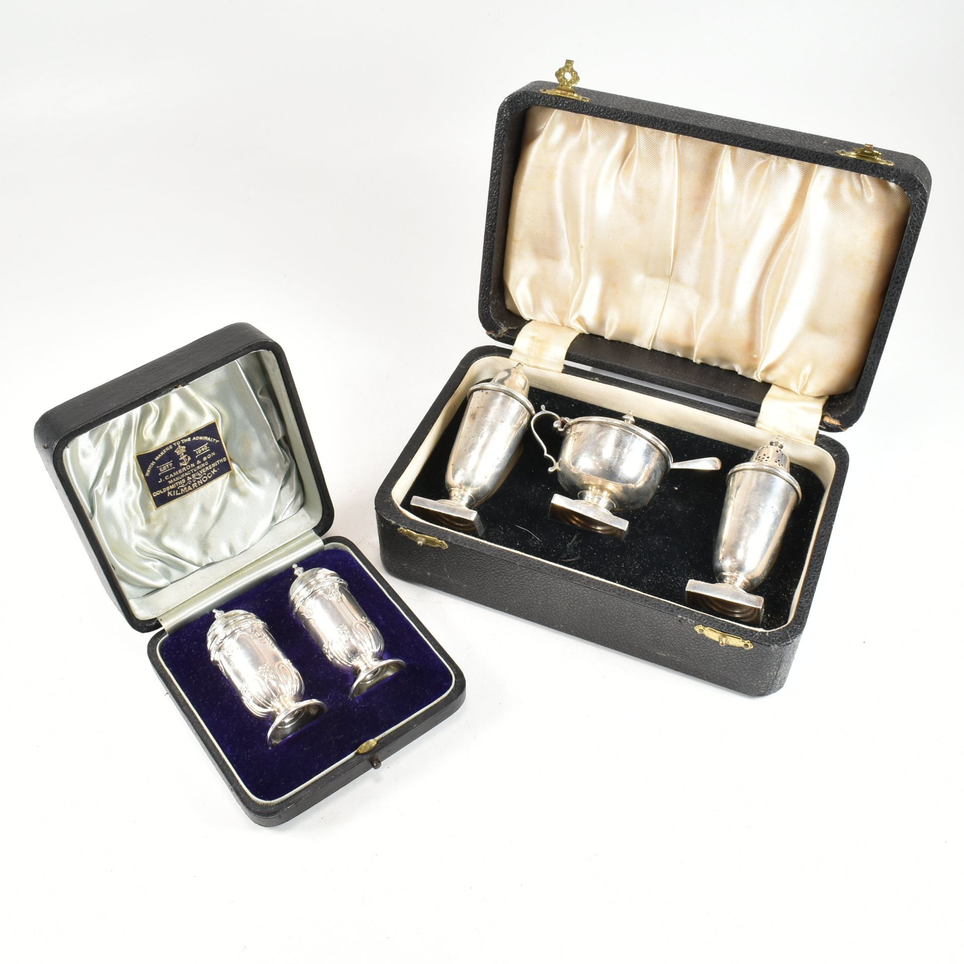 TWO EARLY 20TH CENTURY CASED HALLMARKED SILVER CRUET SETS