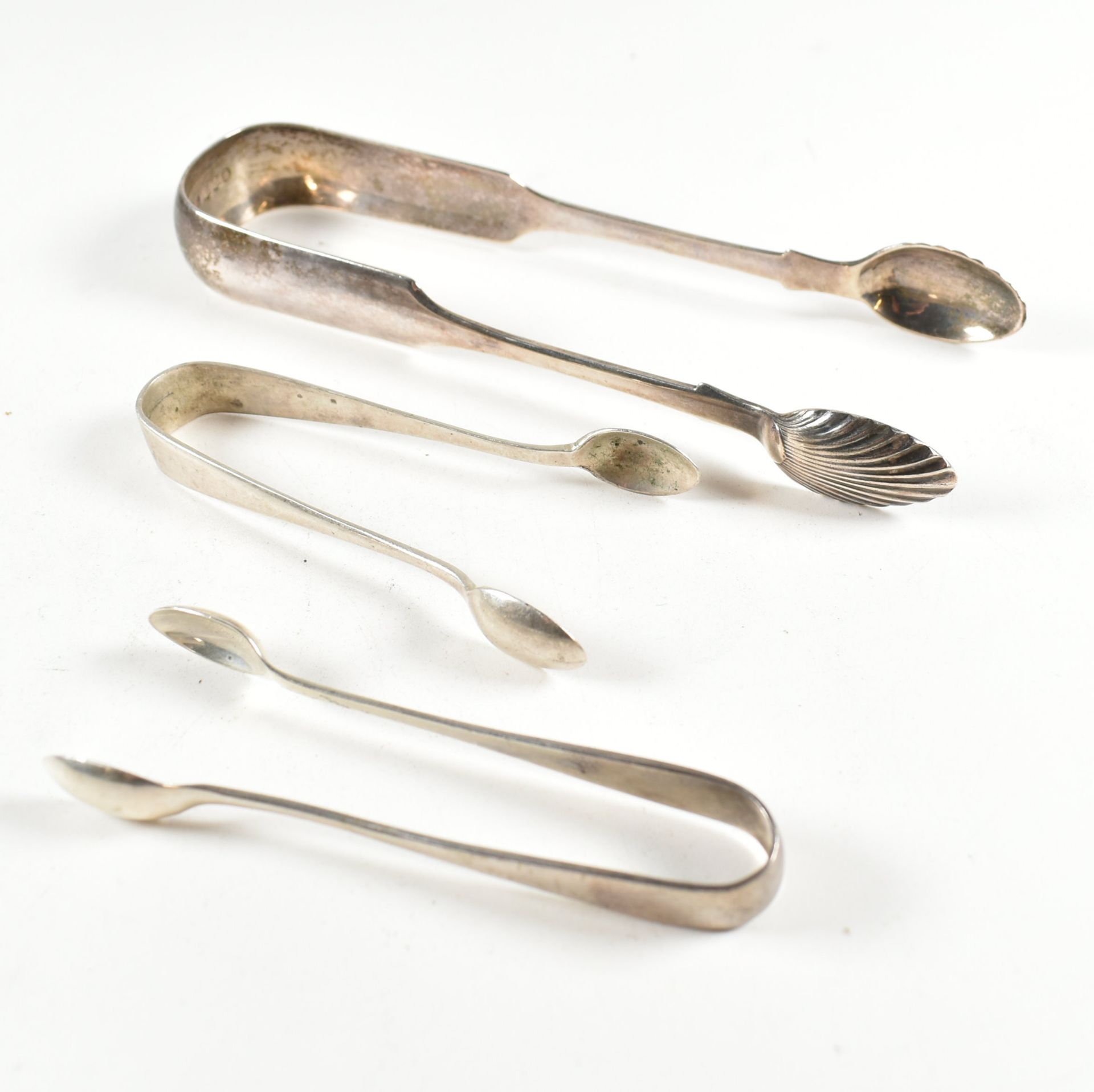 THREE PAIRS OF SUGAR TONGS VICTORIAN & LATER