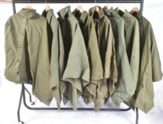 LARGE COLLECTION OF MILITARY RAIN CAPE PONCHOS