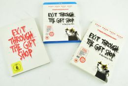 BANKSY (BRITISH, 1974) - THREE VERSIONS OF EXIT THROUGH THE GIFT