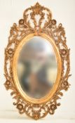 FRENCH INSPIRED GILT WOOD OVAL MIRROR IN NAPOLEON III MANNER