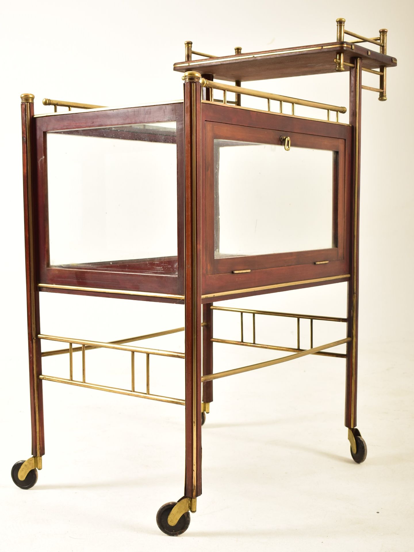 EARLY 20TH CENTURY MAHOGANY & BRASS GLAZED COCKTAIL TROLLEY