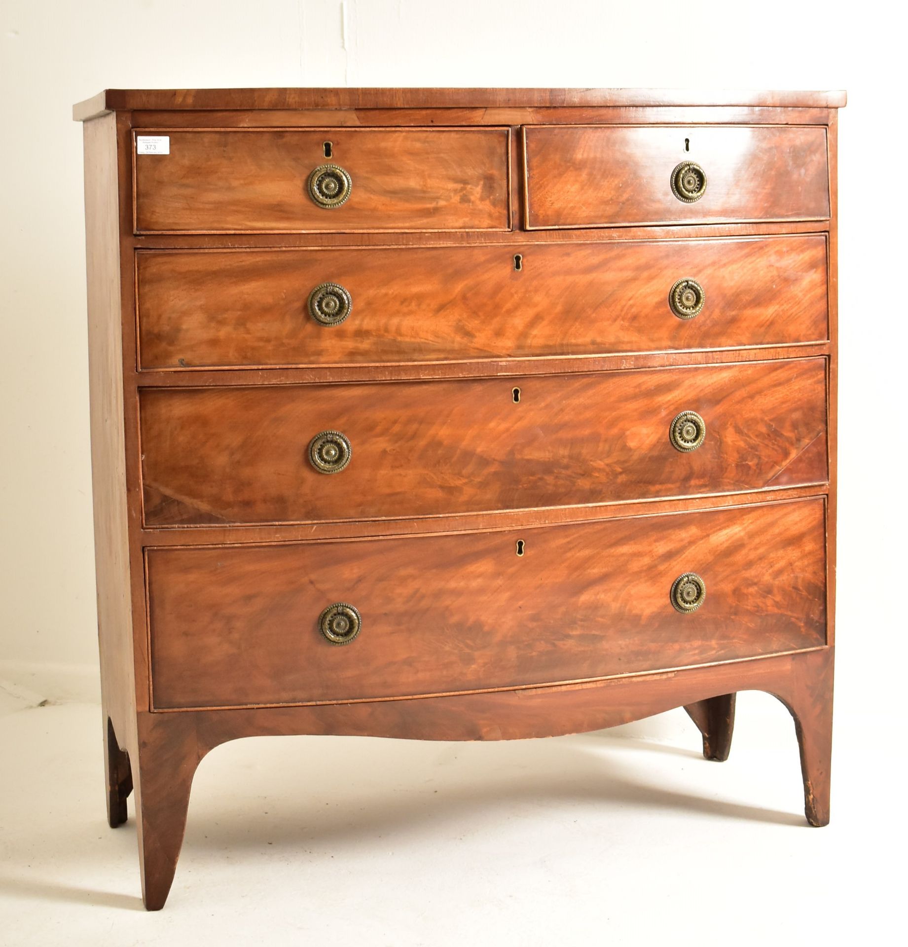 GEORGE III FLAME MAHOGANY BOW FRONT CHEST OF DRAWERS