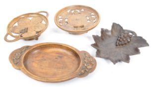 COLLECTION OF WOODEN BLACK FOREST TAZZAS AND PLATES