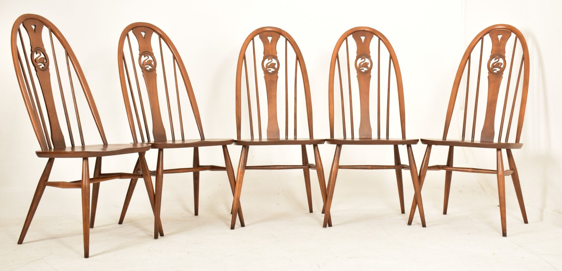 FIVE MID CENTURY ERCOL WINDSOR SWAN-BACK DINING CHAIRS