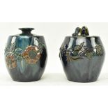 ELTONWARE POTTERY, CLEVEDON - TWO LIDDED TOBACCO JARS