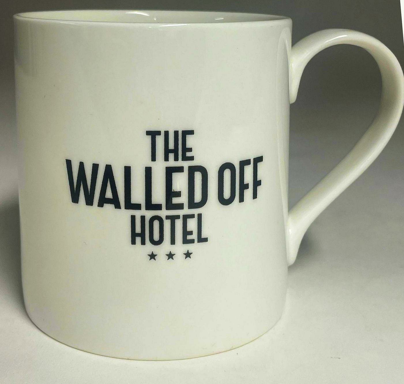 AFTER BANKSY (B. 1973) - WALLED OFF HOTEL POSTER AND MUG SET - Image 11 of 12